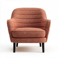 Upholstered accent chair with high back in orange fabric and wooden legs